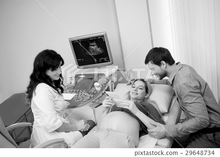 Monochrome shot of a loving pregnant couple at the 29648734
