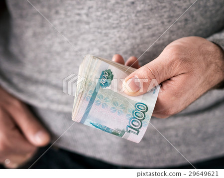 Hands hold rubles 29649621