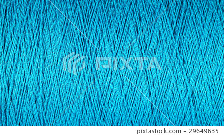 Spool of blue thread macro background Spool of blue thread macro background 29649635