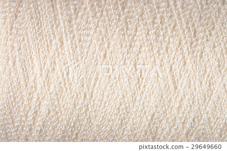 Spool of white thread macro background 29649660