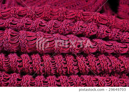 Stack of red melange openwork knitted fabric Stack of red melange openwork knitted fabric 29649703
