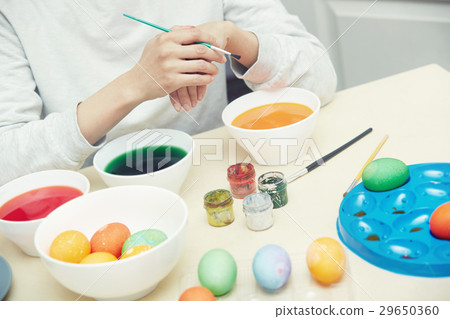 Woman preparing Easter eggs 29650360