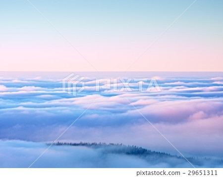 Peaks of mountains above mist, winter scenery. Peaks of mountains above mist, winter scenery. 29651311