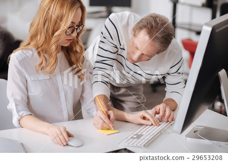 Positive office managers collaborating at the Positive office managers collaborating at the 29653208