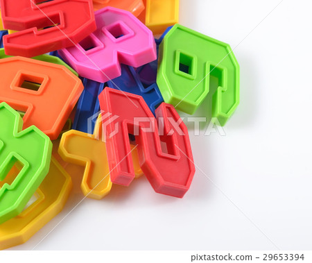 Colorful plastic numbers on a white 29653394