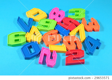 Plastic colored numbers on a blue background 29653571