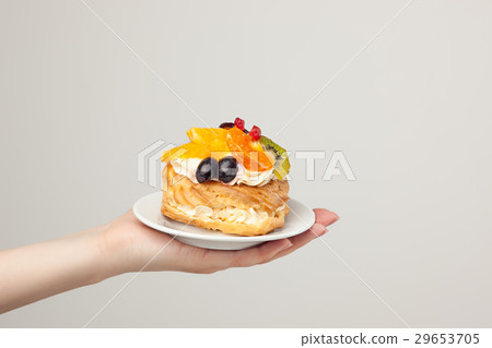 Closeup of cake with fresh fruits on gray 29653705