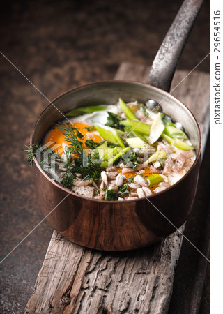 Scrambled eggs  with greens in the copper pot  29654516