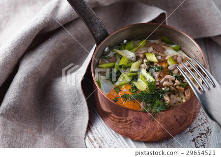 Scrambled eggs  with greens in the copper pot  29654521