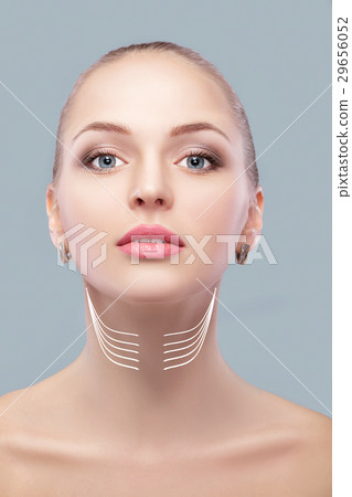 woman with arrows on face neck lifting concept 29656052