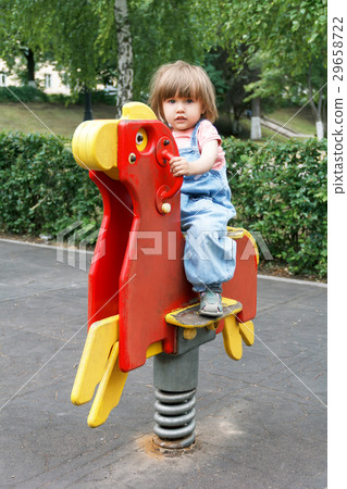 Girl riding at hutches with disheveled hair Girl riding at hutches with disheveled hair 29658722