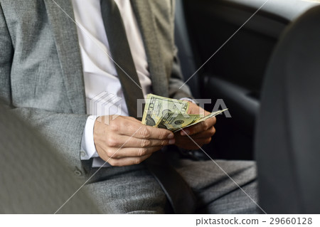 man counting dollar bills man counting dollar bills 29660128