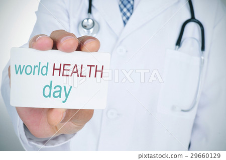 doctor with signboard with text world health day doctor with signboard with text world health day 29660129