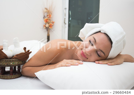 Attractive young woman lying on the massage spa Attractive young woman lying on the massage spa 29660484