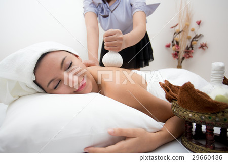 Attractive young woman lying on the massage spa 29660486