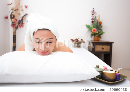Attractive young woman lying on the massage spa Attractive young woman lying on the massage spa 29660488