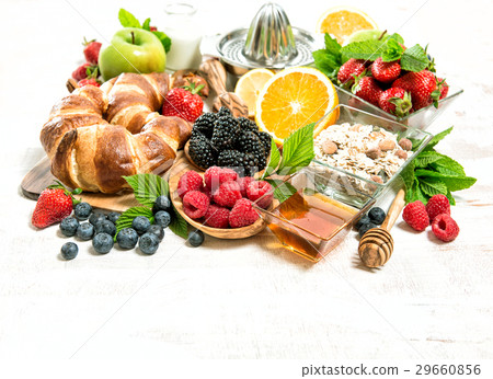 Breakfast with croissants, muesli, fresh berries 29660856