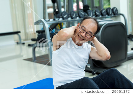 Asian Adult Man Smiling and Happy to Exercise in Fitness Asian Adult Man Smiling and Happy to Exercise in Fitness 29661372