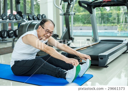 Asian Adult Man Smiling and Happy to Exercise in Fitness Asian Adult Man Smiling and Happy to Exercise in Fitness 29661373