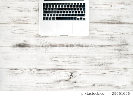 Laptop computer keyboard over wooden desk. Laptop computer keyboard over wooden desk. 29661696