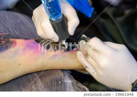 Artist is making the tattoo close up Artist is making the tattoo close up 29661846