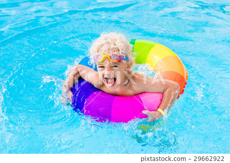 Child with toy ring in swimming pool Child with toy ring in swimming pool 29662922