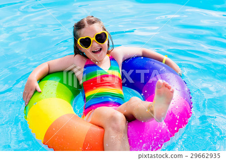 Child with toy ring in swimming pool Child with toy ring in swimming pool 29662935