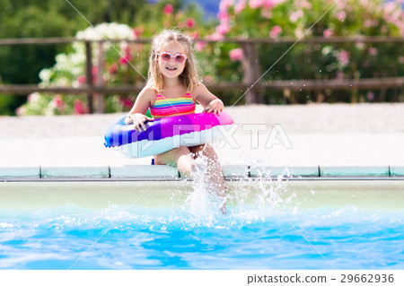 Child with toy ring in swimming pool Child with toy ring in swimming pool 29662936