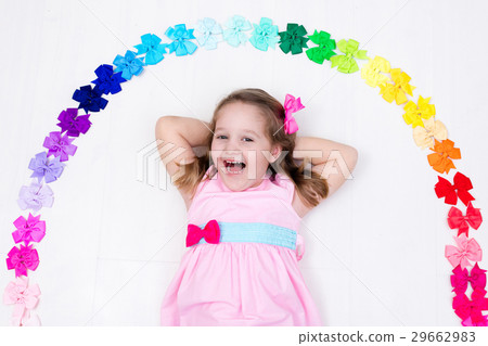 Little girl with colorful bow. Hair accessory Little girl with colorful bow. Hair accessory 29662983