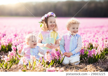 Kids playing in flower field 29663225