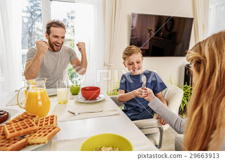 Friendly family having fun before breakfast 29663913