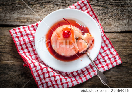 Panna cotta with berry sauce and maraschino cherry Panna cotta with berry sauce and maraschino cherry 29664016