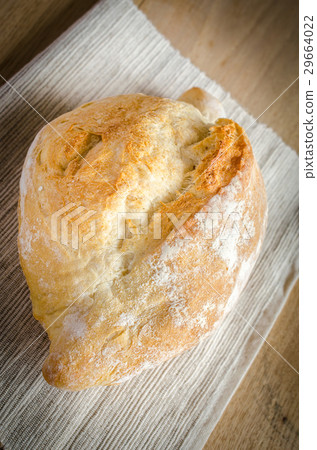 Loaf of white bread on the wooden table Loaf of white bread on the wooden table 29664022