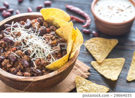 Bowl of chili con carne with tortilla chips 29664035