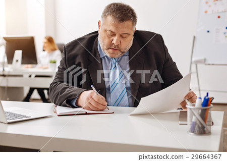 Frontline company employee focused on the task Frontline company employee focused on the task 29664367