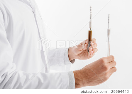 Scientist keeping flasks of water Scientist keeping flasks of water 29664443