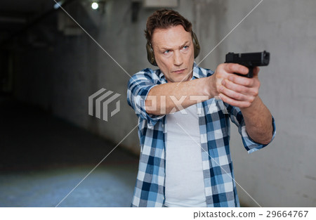 Handsome nice man aiming at the target 29664767