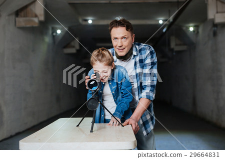 Positive delighted man standing behind his Positive delighted man standing behind his 29664831