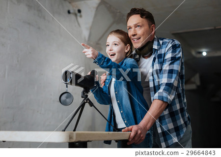 Happy exited girl pointing at something 29664843