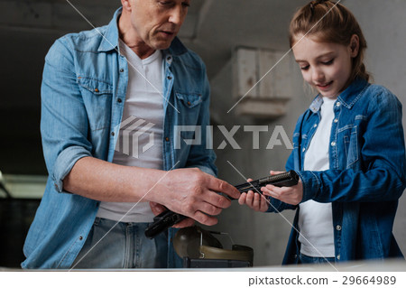 Pleasant cute girl holding a handgun Pleasant cute girl holding a handgun 29664989