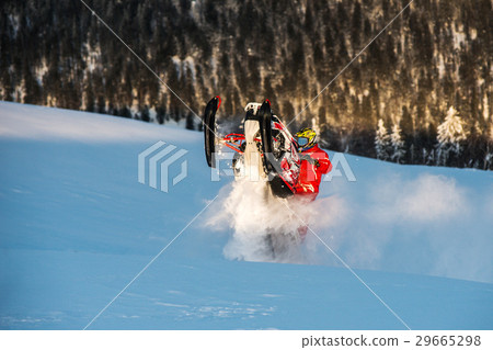 Rider on the snowmobile in the mountains. active Rider on the snowmobile in the mountains. active 29665298