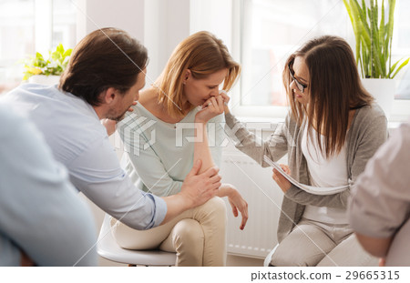 All colleagues soothing their friend All colleagues soothing their friend 29665315