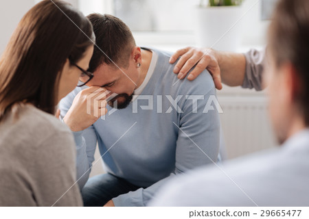 Disappointed man bowing his head Disappointed man bowing his head 29665477
