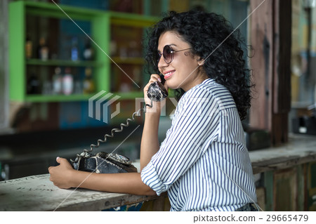 Girl is talking on phone Girl is talking on phone 29665479