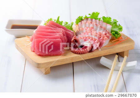 sashimi tuna and squid on wood background sashimi tuna and squid on wood background 29667870