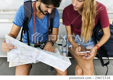 Couple traveling together with a map Couple traveling together with a map 29671516