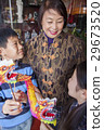 Asian family in front of store 29673520