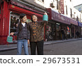 Asian family in front of store 29673531