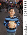Boy holding dumplings 29673535