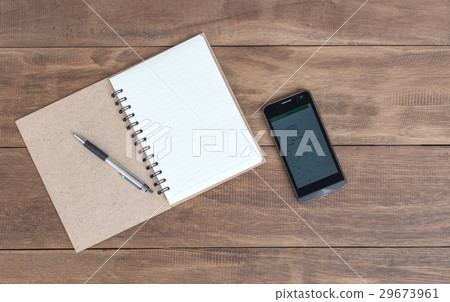 Open blank notebook , pen and mobile on the table Open blank notebook , pen and mobile on the table 29673961